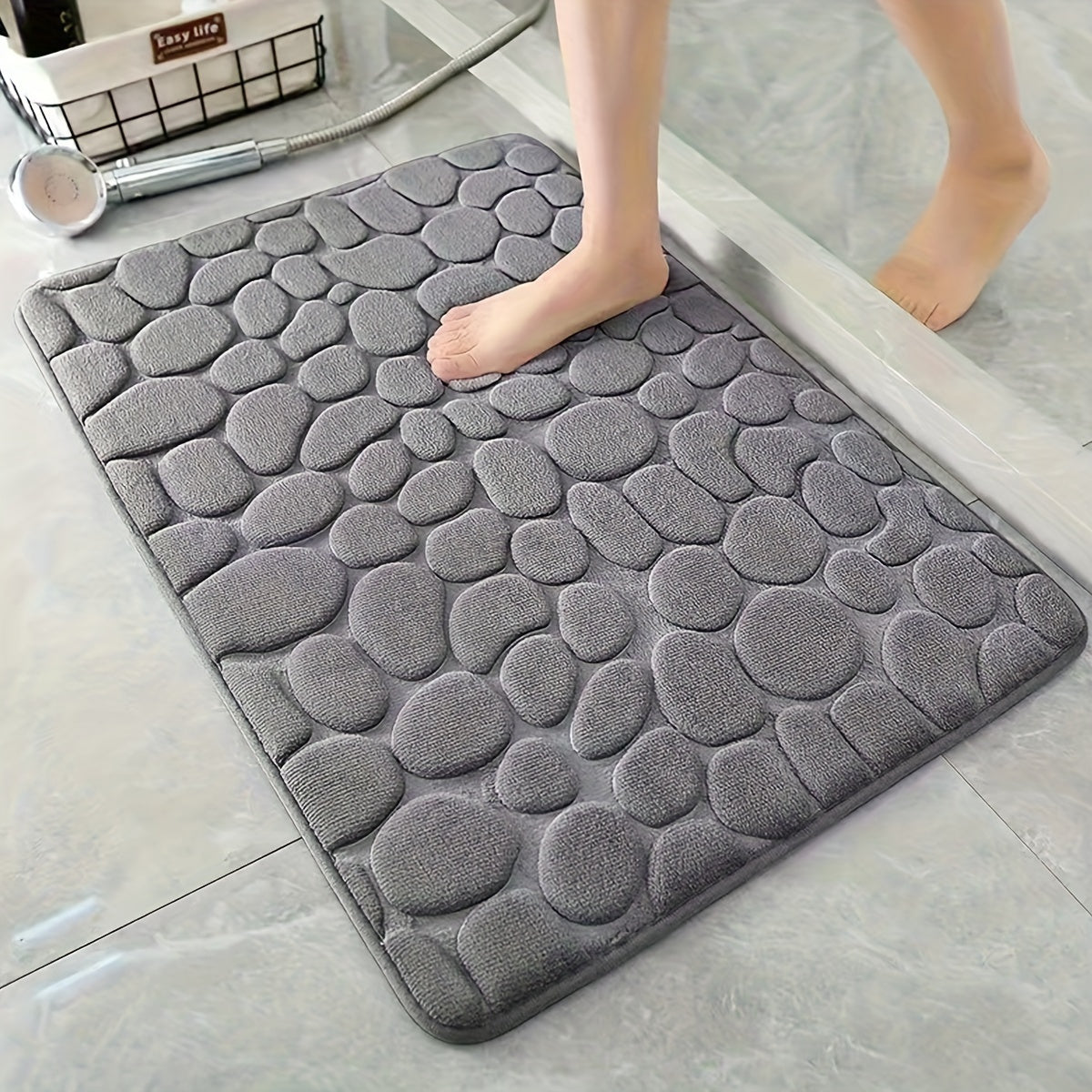 Pamper Your Feet with our Luxurious 3D Pebble Design Bath Rug! This Quick-Dry Non-Slip Bathroom Mat is made of Soft and Comfortable Polyester Memory Foam. It is Woven with a density of 700gsm and is 1.5cm Thick. Perfect for Home Decor and as Holiday