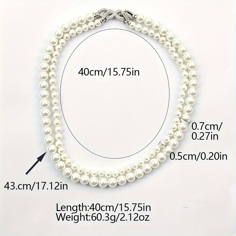 Indulge in Elegance with the JASTAR Double Strand Shell Pearl Necklace featuring 6mm and 8mm pearls, adorned with an Infinite Clasp and full zirconia inlay. Elevate your style with this luxurious fashion statement perfect for women, and with its