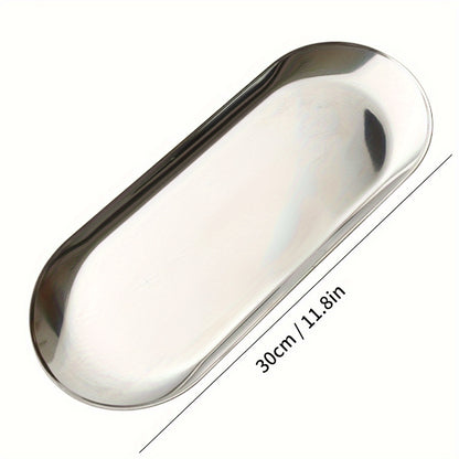 Oval-shaped stainless steel food tray for breakfast in kitchen or restaurant.