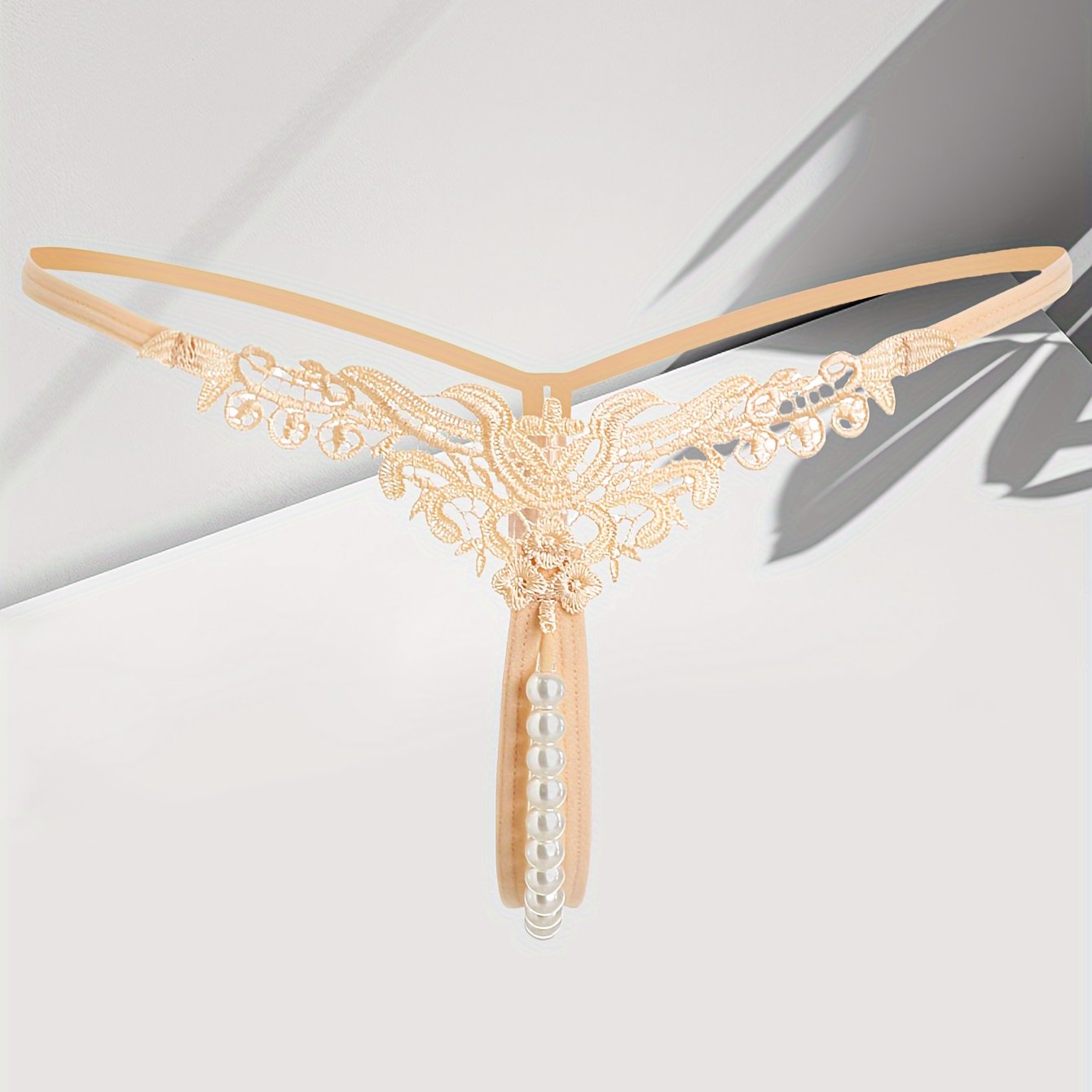 Women's low-rise thong with faux pearl design, sexy lingerie & underwear.