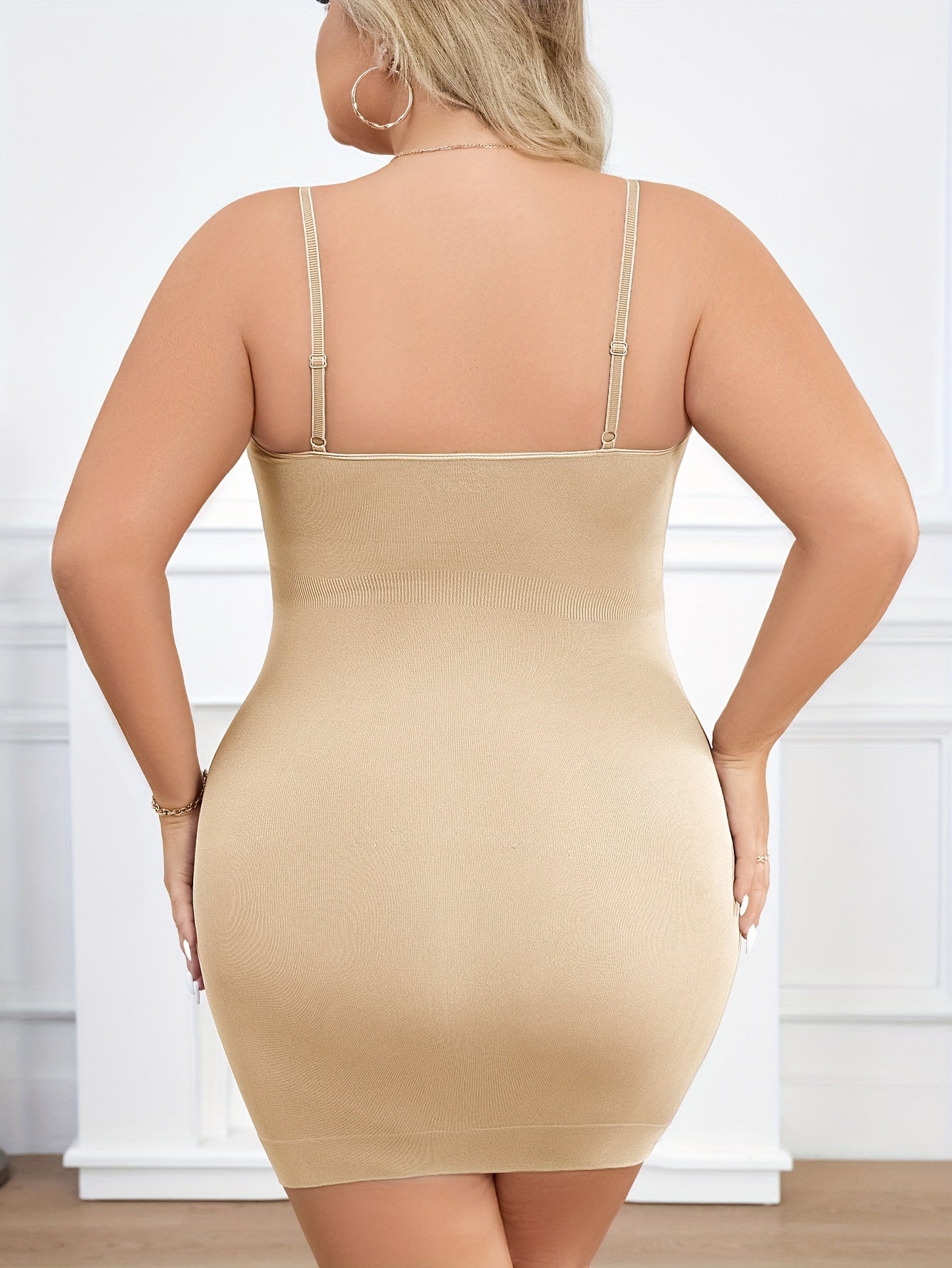 Plus size slip shapewear dress with built-in bra, adjustable straps, and seamless tummy control.