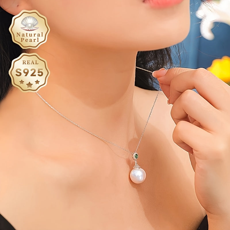 Give your loved one a special treat with this must-have gift box containing a stunning S925 silver pendant necklace featuring a 13-14mm round natural freshwater pearl. Each necklace is unique, with variations in natural pearls, shapes, and colors. The