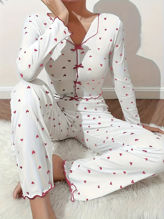 Heart print lounge set with frill trim and bow detail, featuring a V-neck crop top and pants for a comfortable and relaxed fit in the fall.