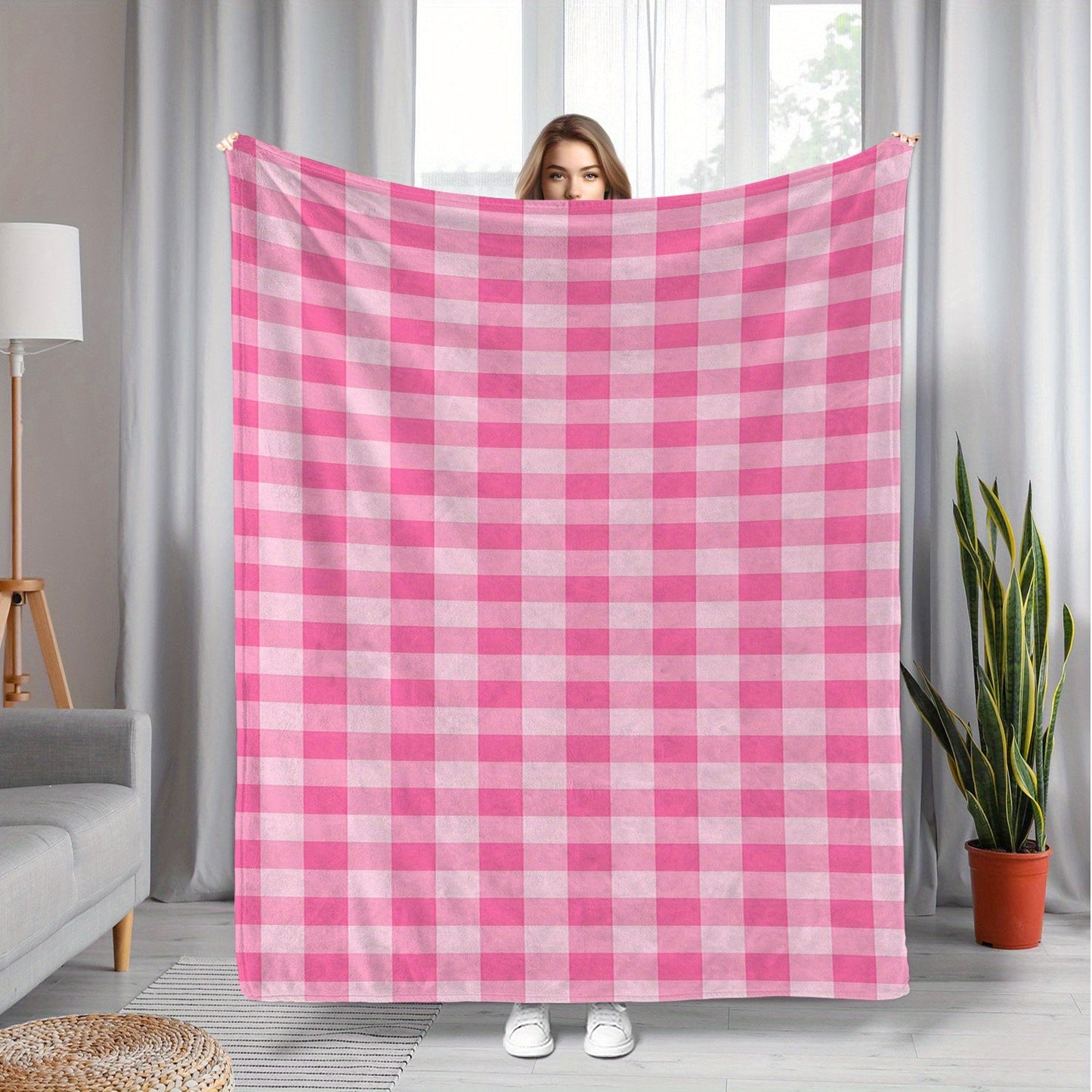 Soft and cozy polyester knit pink gingham flannel throw blanket. Ideal for adding a touch of contemporary style to your bedroom, sofa, or living room decor. Perfect for all-season use and makes an ideal gift for girls, daughters, and sisters. Features a