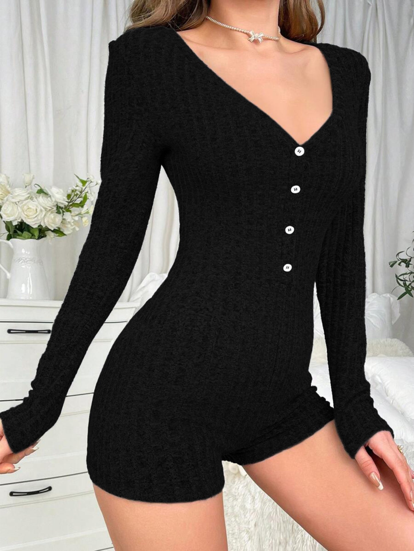 Ribbed pajama romper with long sleeves, scoop neck, and slim fit for women's sleepwear.