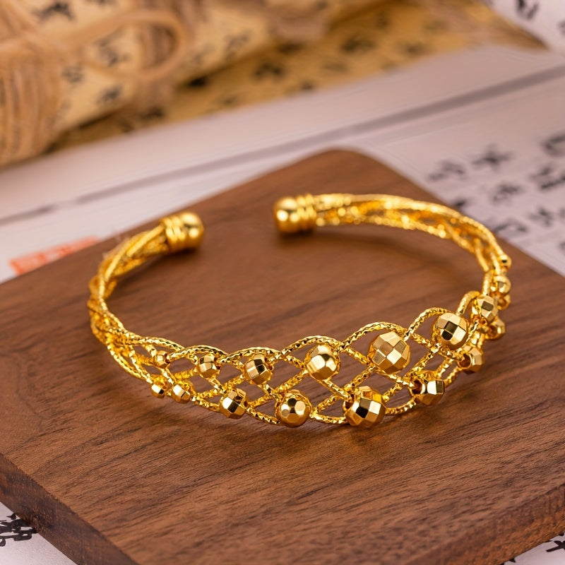 Make a statement with our Boho Luxury 24K Gold Plated Copper Cuff Bracelet, an adjustable open bangle featuring a shiny weave design. This stunning piece is perfect for any occasion, whether it be a party, wedding, or a Mother's Day gift. Elevate your