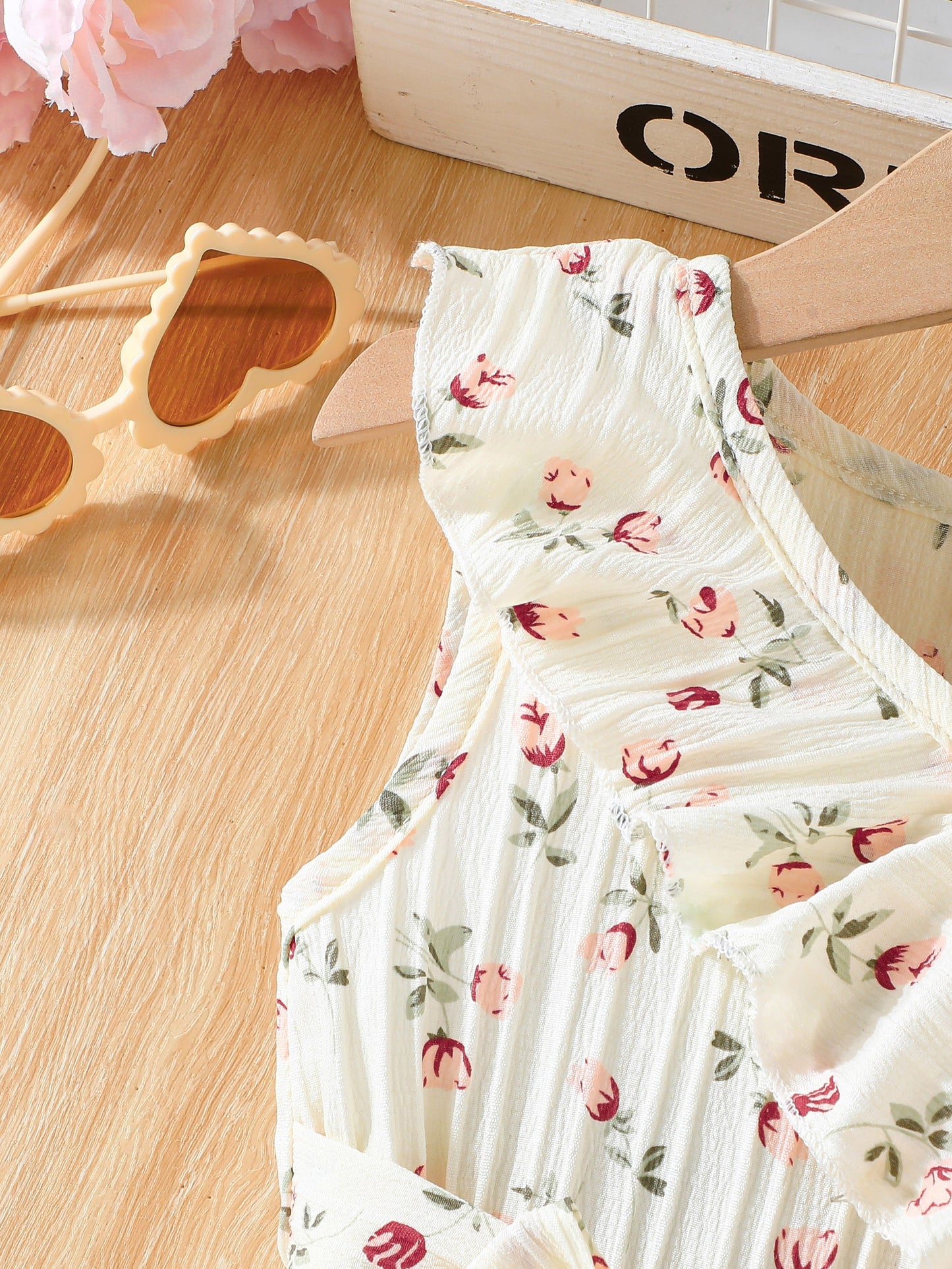 Elegant sleeveless floral dress for girls, perfect for parties and beach outings.