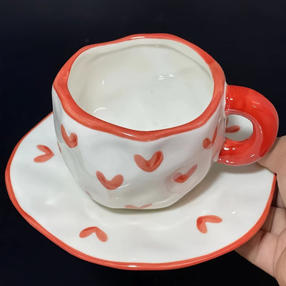 Handcrafted ceramic coffee mug and saucer set with whimsical patterns. Reusable and recyclable, perfect for tea or latte. Hand wash only.