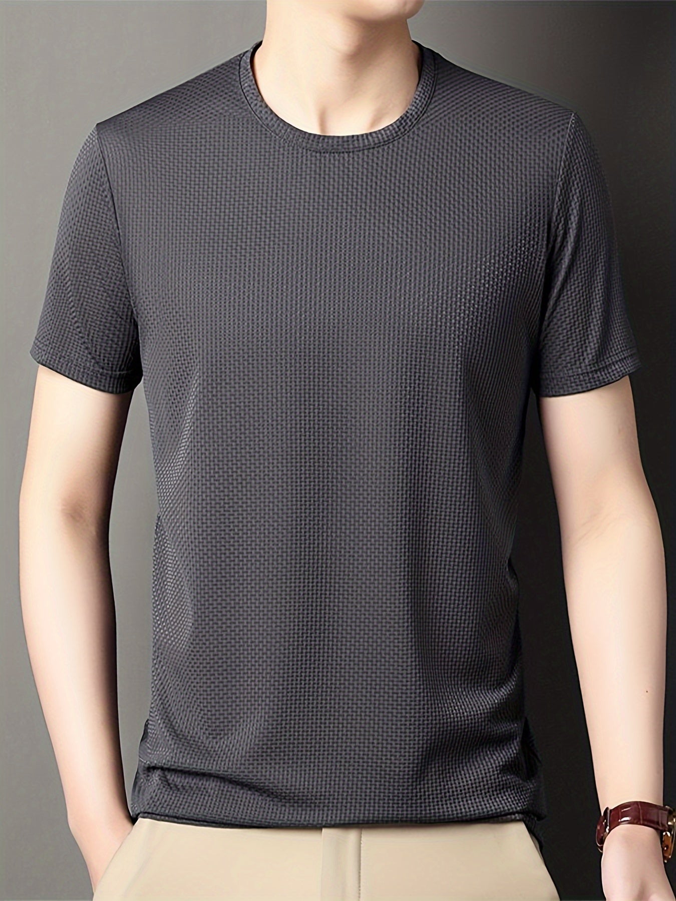 Men's breathable stretch t-shirt in solid color, perfect for casual summer activities like golf. Lightweight and comfortable with a stretchy knit fabric.