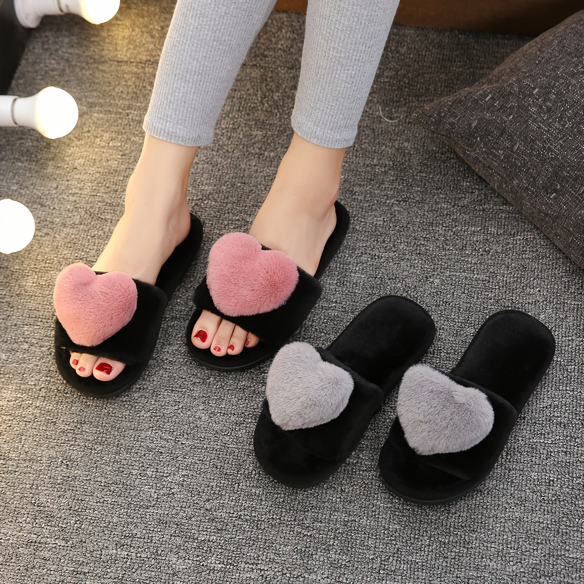 Warm and cozy women's plush slippers with heart accent for indoor comfort and style.