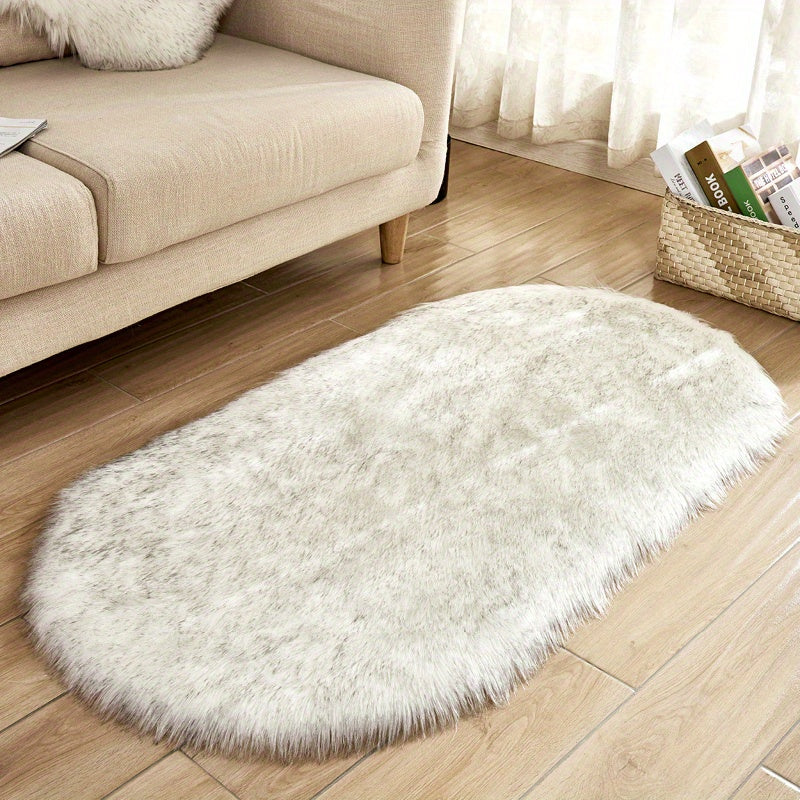 One piece of a luxurious Super Soft Area Rug, featuring a Plush Fluffy Faux Sheepskin design in an Oval shape, perfect for adding warmth to your Living Room or Bedroom. This Machine Washable Bedside Rug is made of Shaggy Plush Carpet Faux material, ideal