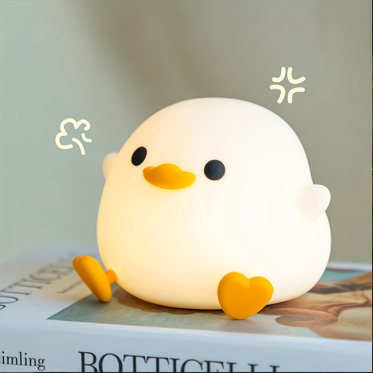 Duck-shaped silicone night light and pat lamp: Soft, eye-safe USB rechargeable bedside light for cozy room decor.