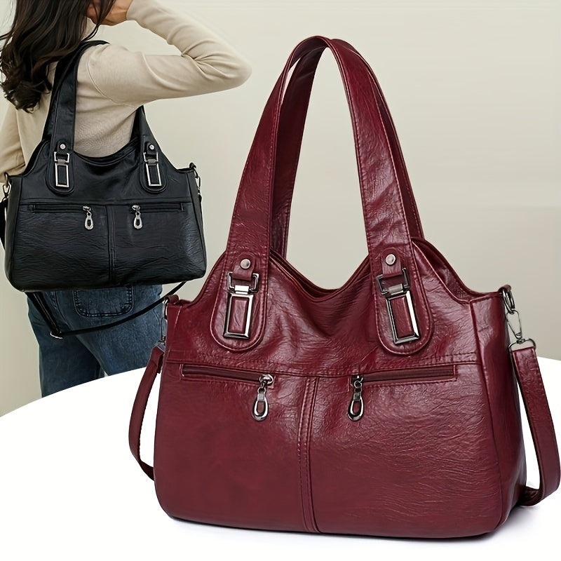 Stylish women's crossbody bag with multiple pockets, detachable strap, chic design, zip closure, and polyester lining.