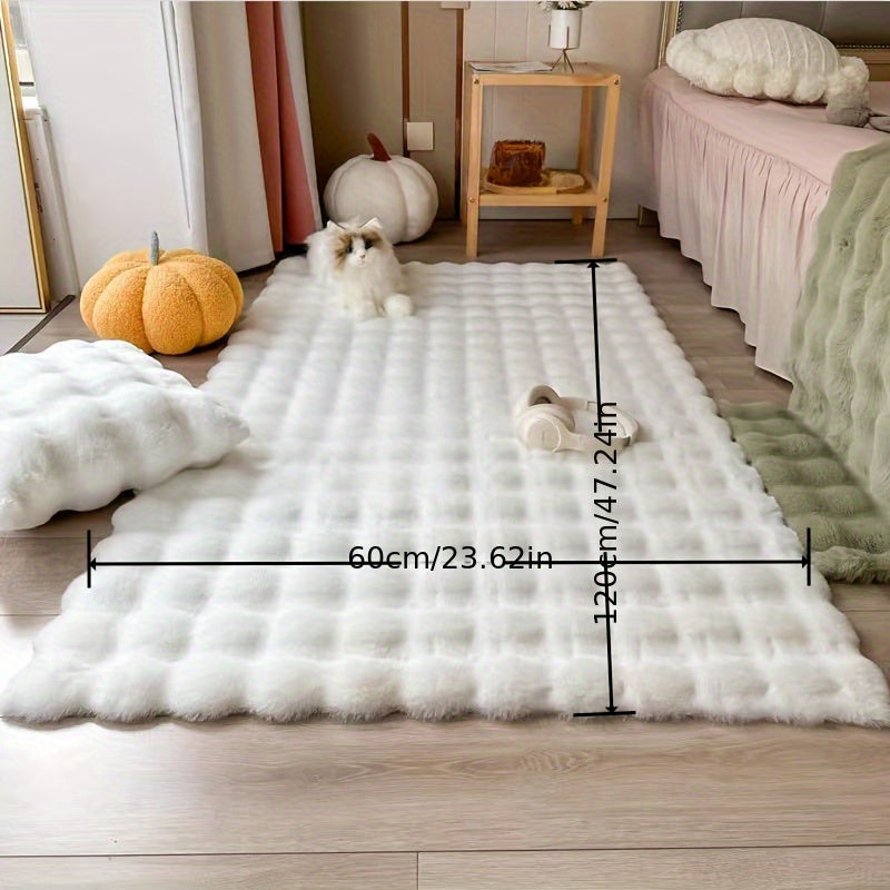 This high-pile plaid carpet in winter features a soft pink rabbit faux fur touch, making it warm and fluffy. The non-slip faux fur rug is perfect for adding a cozy touch to your living room. Measuring 60 x 120 cm, it is the ideal size for any space.