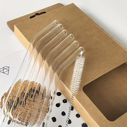 A package containing 6 high borosilicate transparent glass straws and 1 cleaning brush. These heat-resistant, washable, and reusable straws are perfect for enjoying your favorite drinks.