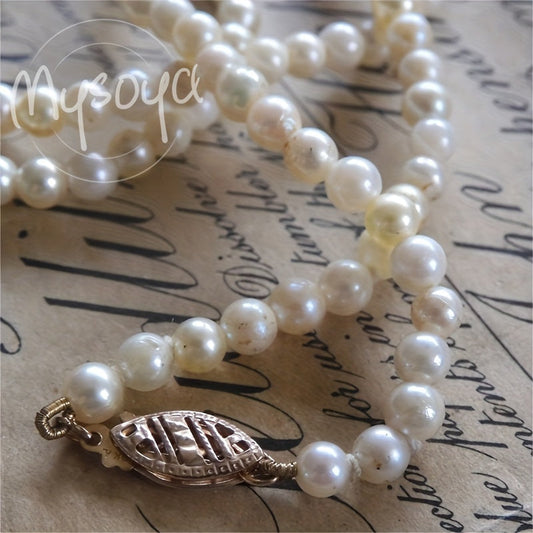 Elegant freshwater pearl necklace crafted by hand, featuring natural 6-7mm white pearls - the June birthstone. This luxurious piece is free of any plating and is perfect for both weddings and everyday wear. An ideal Valentine's gift, it comes with a