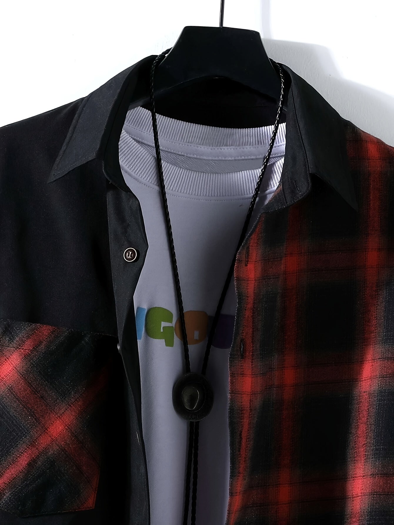 Casual plaid long sleeve shirt for men made of 100% polyester fabric with button and pocket detail. Suitable for spring/fall, regular fit with lapel collar.