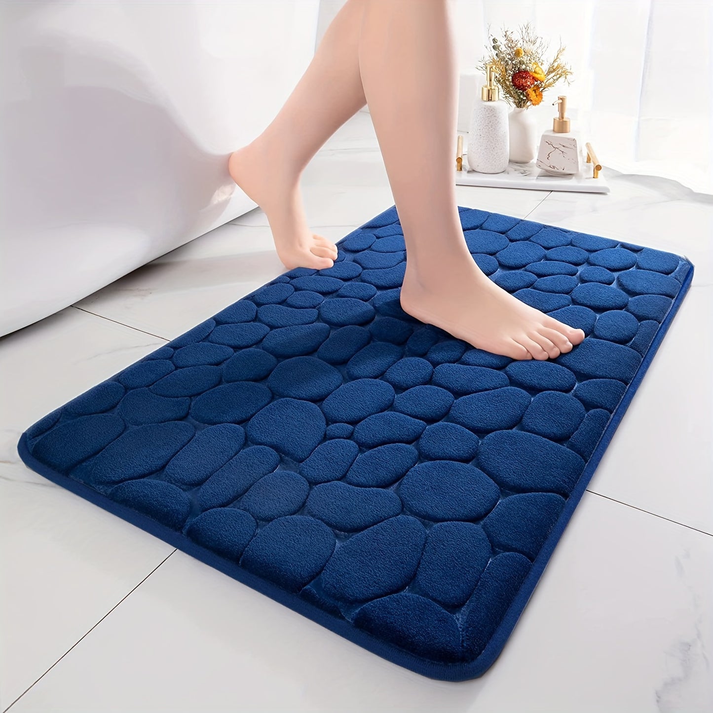 Soft, memory foam bath rug with cobblestone embossment. Rapid water absorbent, non-slip, and washable. Ideal for shower rooms, bathrooms, kitchens, bedrooms, and as decorative accessories.