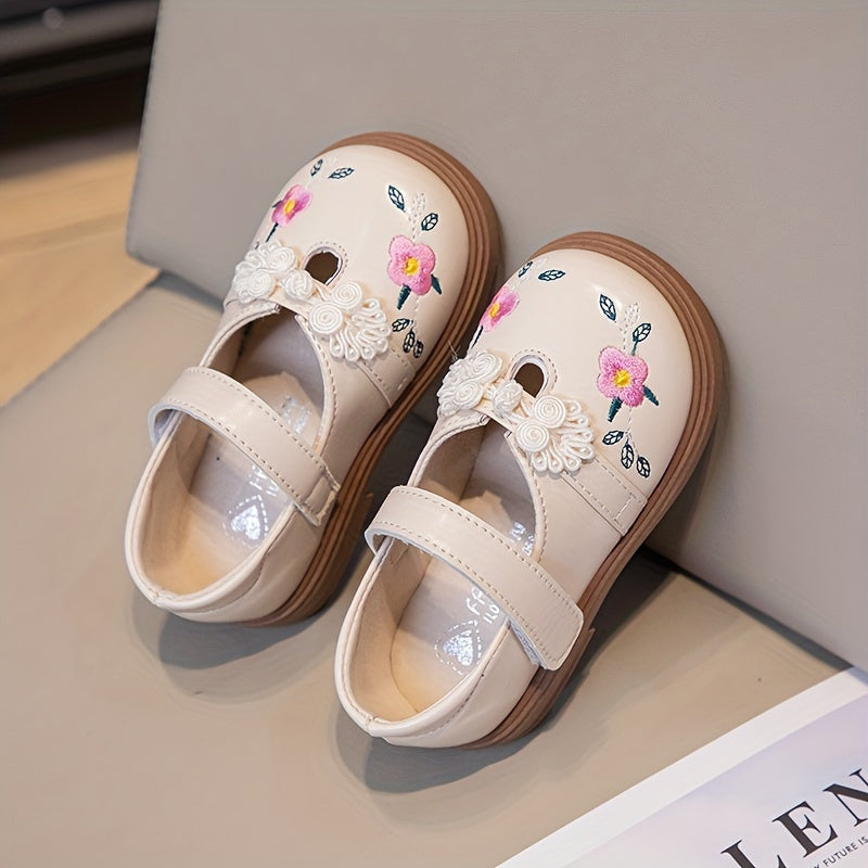 Girls' Mary Jane shoes with floral accents, soft non-slip sole for babies and toddlers.