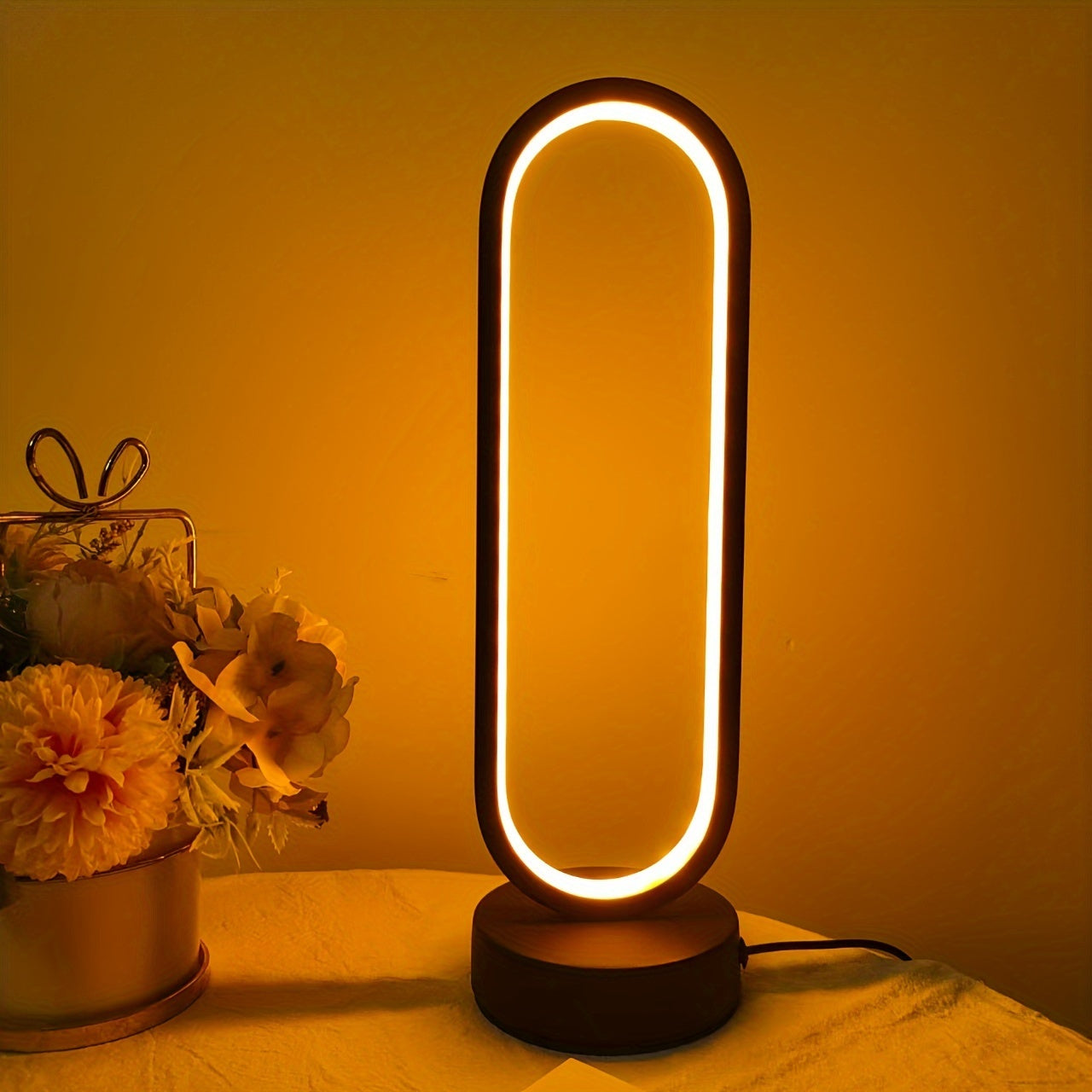 USB-powered LED ring table lamp in black or white; dimmable for bedroom and living room decor.