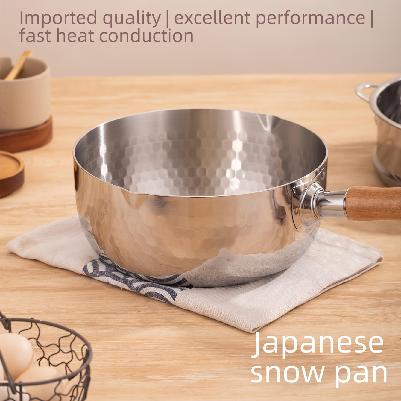 A small soup pot for home use without power supply made of 304 brushed finish stainless steel, featuring a wooden handle and induction compatibility