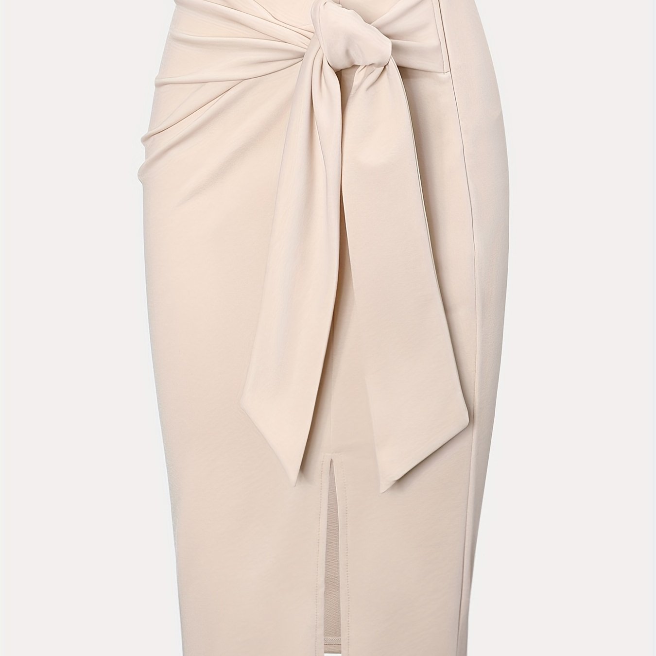 Chic high-waisted knee-length skirt with bow and slit for women.