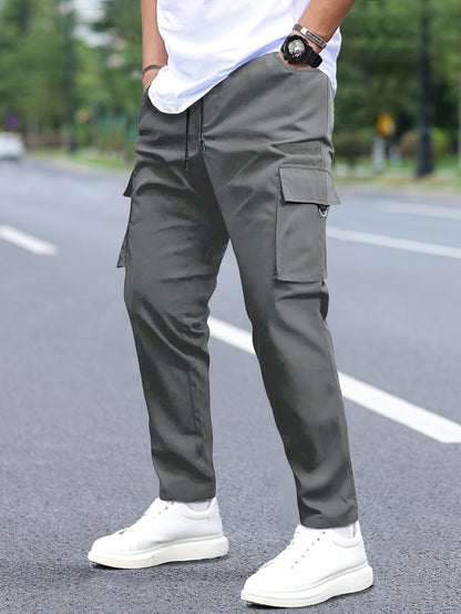 Men's cargo pants with multiple pockets and drawstring for outdoor activities.