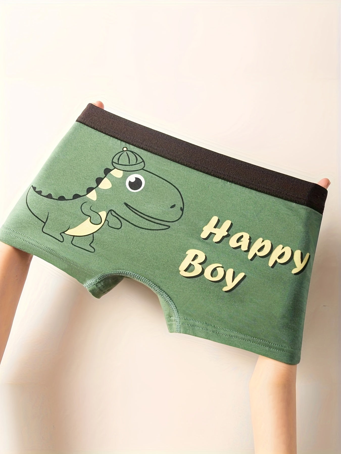 4 children's boxer briefs with cute dinosaur print, made of soft breathable cotton, suitable for all seasons.