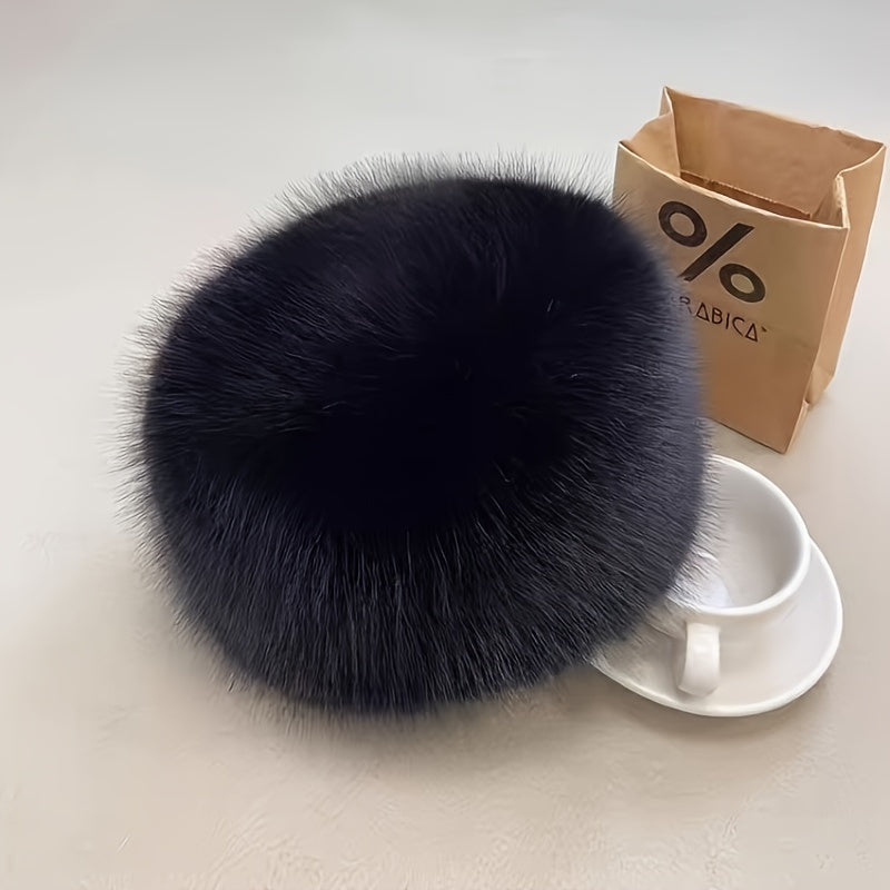 Faux fur bucket hat for women with flat top dome style, providing thick, warm ear protection. Chic snow spirit design, machine washable for winter outings.