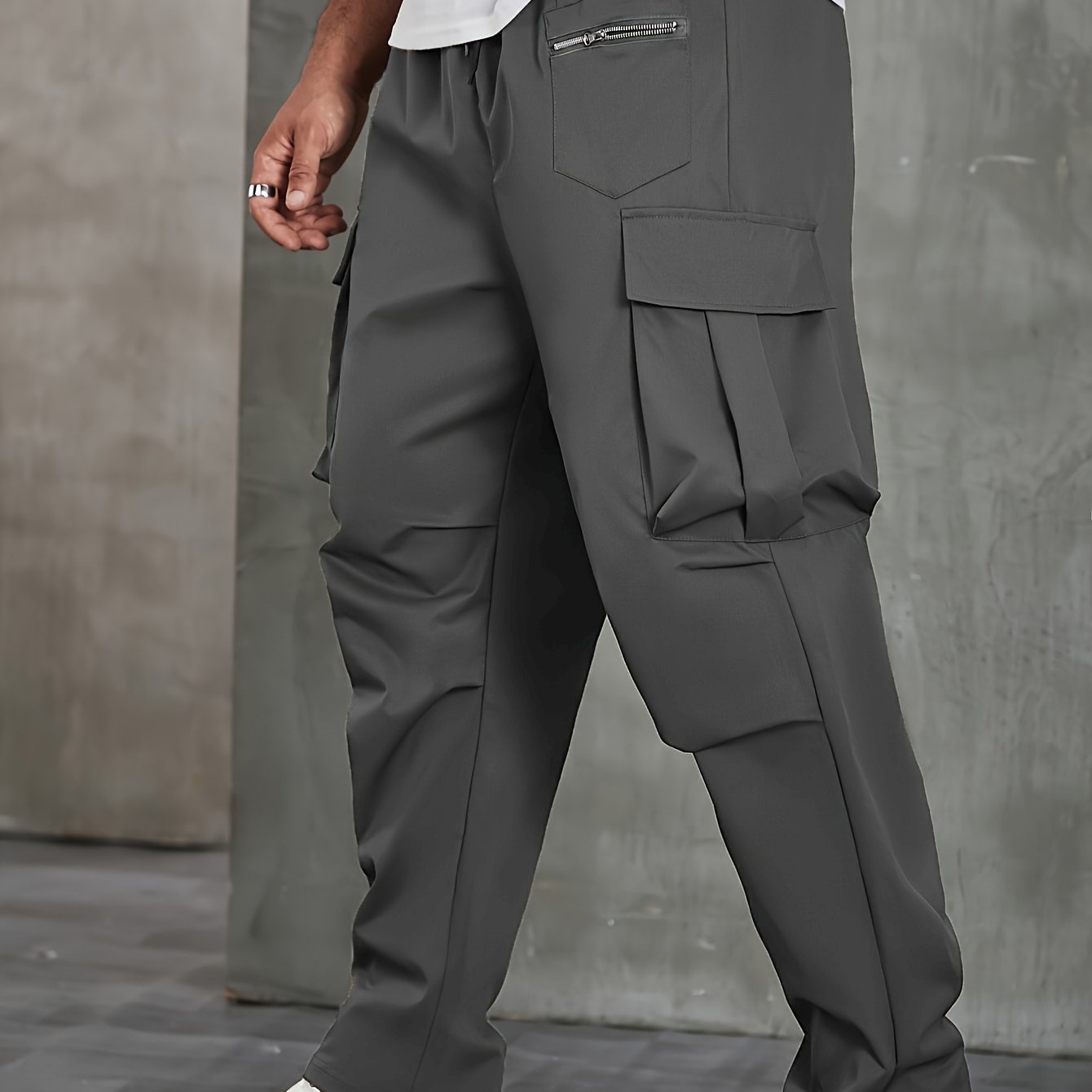 Men's solid cargo pants in plus sizes for spring and fall outdoor sports.