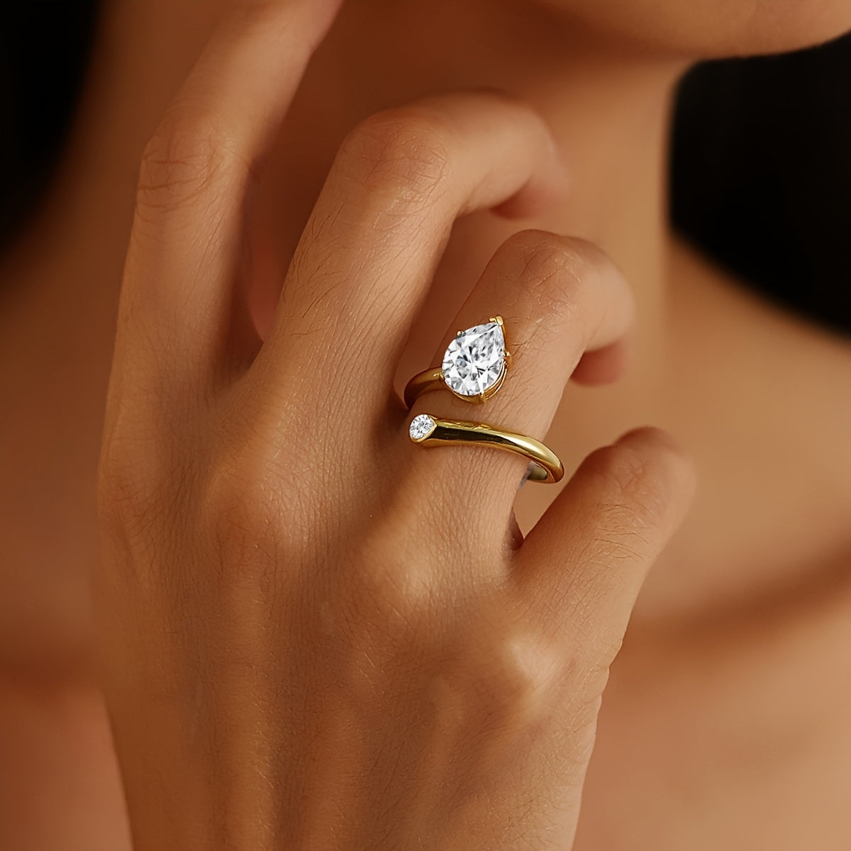 Luxurious 18K Gold Plated 925 Silver Moissanite Engagement Ring featuring a stunning 2 Carat Pear Shaped Gemstone. This Boho Royal Style ring is perfect for an April Birthstone or as a Solitaire Ring for a Wedding or Valentine's Day gift. Comes in a