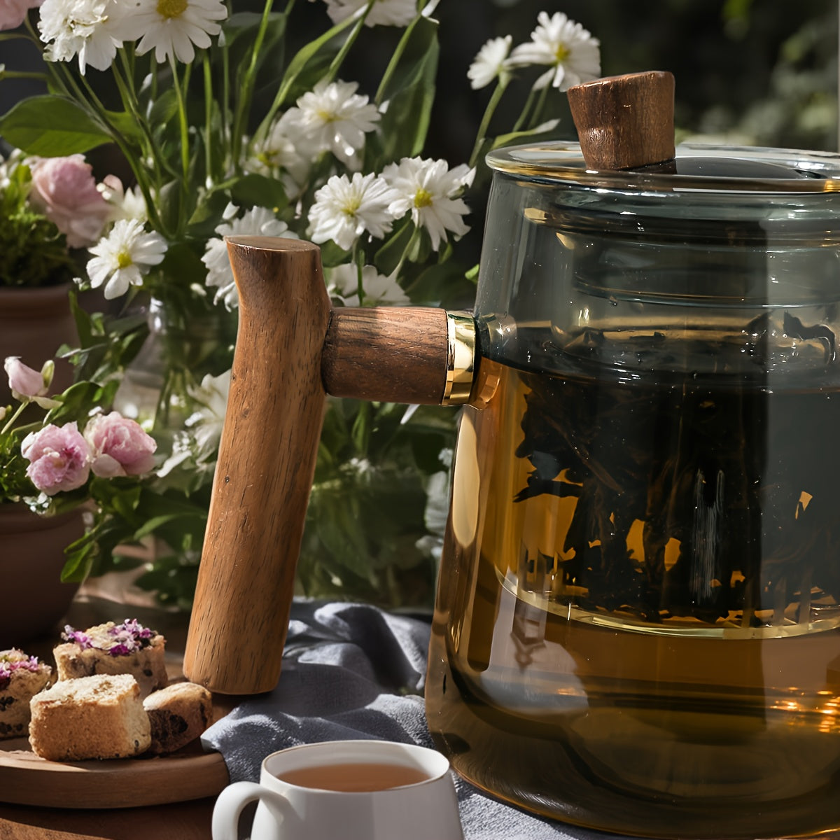 Glass teapot with glass liner and elegant cups, including a lazy tea separation feature. Perfect for outdoor use, this high-end tea set exudes luxury.