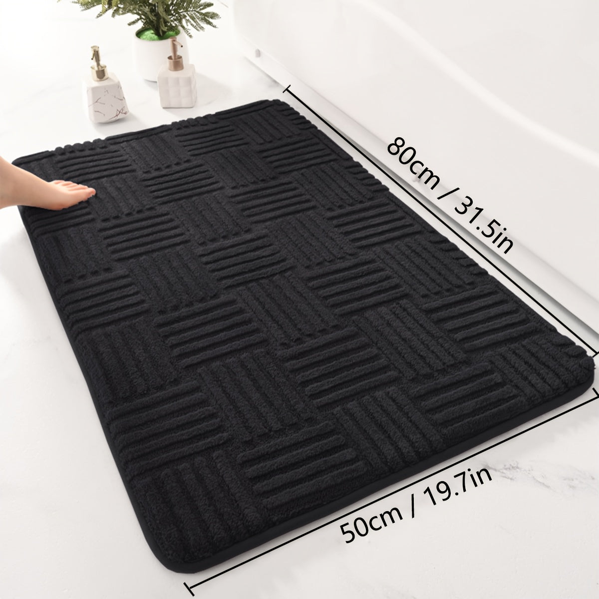 One piece of a thickened bathroom absorbent mat with a non-slip bathtub rug. Can also be used as a home entryway carpet with a solid color and stripe pattern. The mat is rectangular in shape and lightweight, machine-made with a PVC backing. Made of