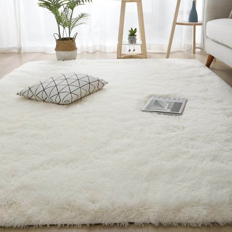 Luxurious soft plush faux fur area rug with anti-slip knitted polyester backing. This machine-made thick, warm, and fluffy mat is perfect for bedroom and living room use. It is hand washable and stain-resistant, making it easy to care for and