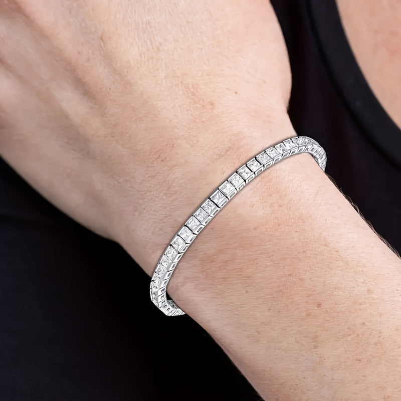 Get noticed with this sophisticated and chic 925 Sterling Silver Plated Moissanite Square-Cut Tennis Bracelet, a versatile piece perfect for everyday wear or special occasions. Give the gift of elegance this Valentine's Day with this timeless accessory