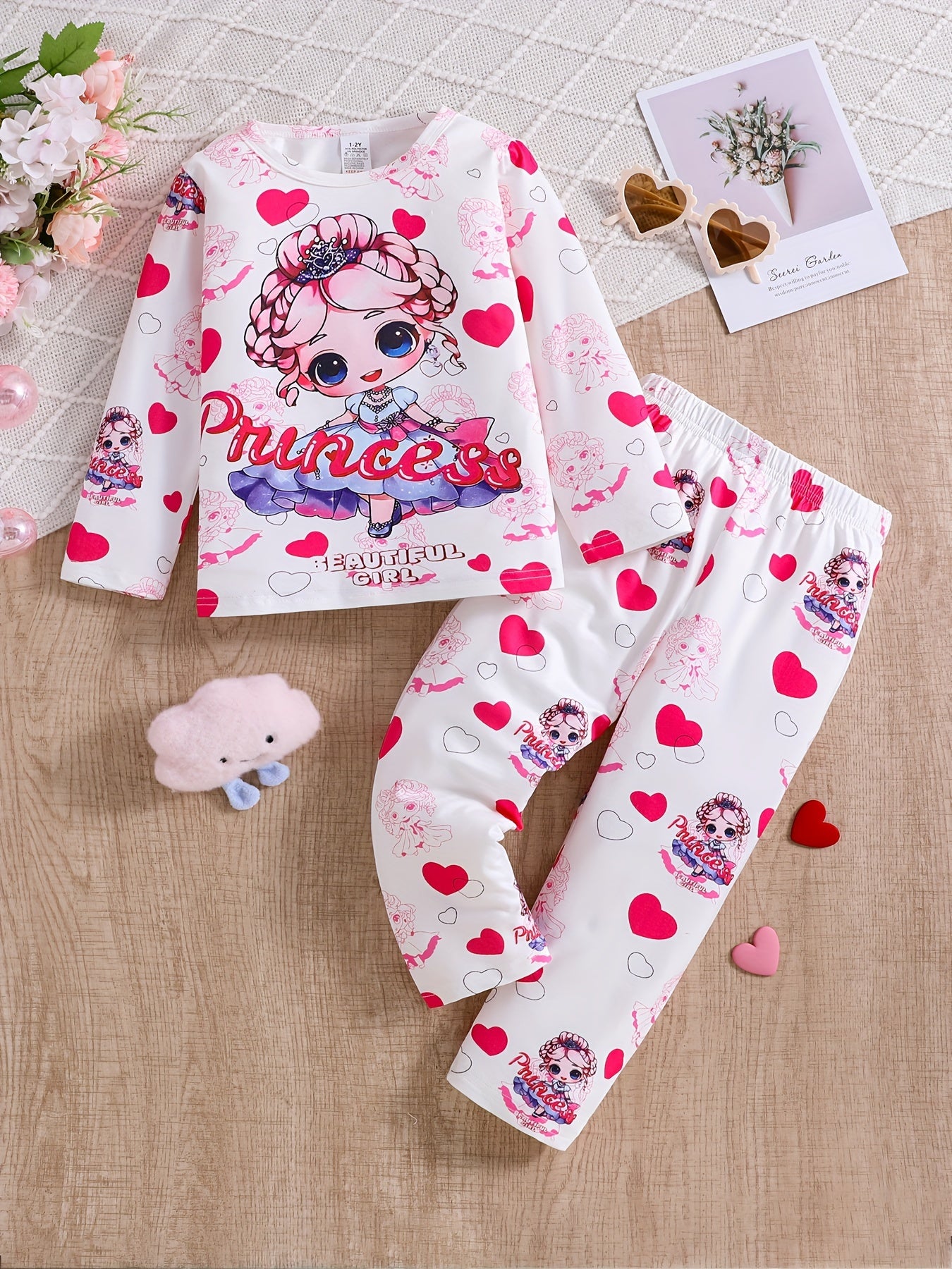 3-pack girls' flame resistant pajama sets with long sleeve crew neck featuring cartoon patterns. Designs include princess, unicorn, and donut cat. Made of polyester spandex for comfortable