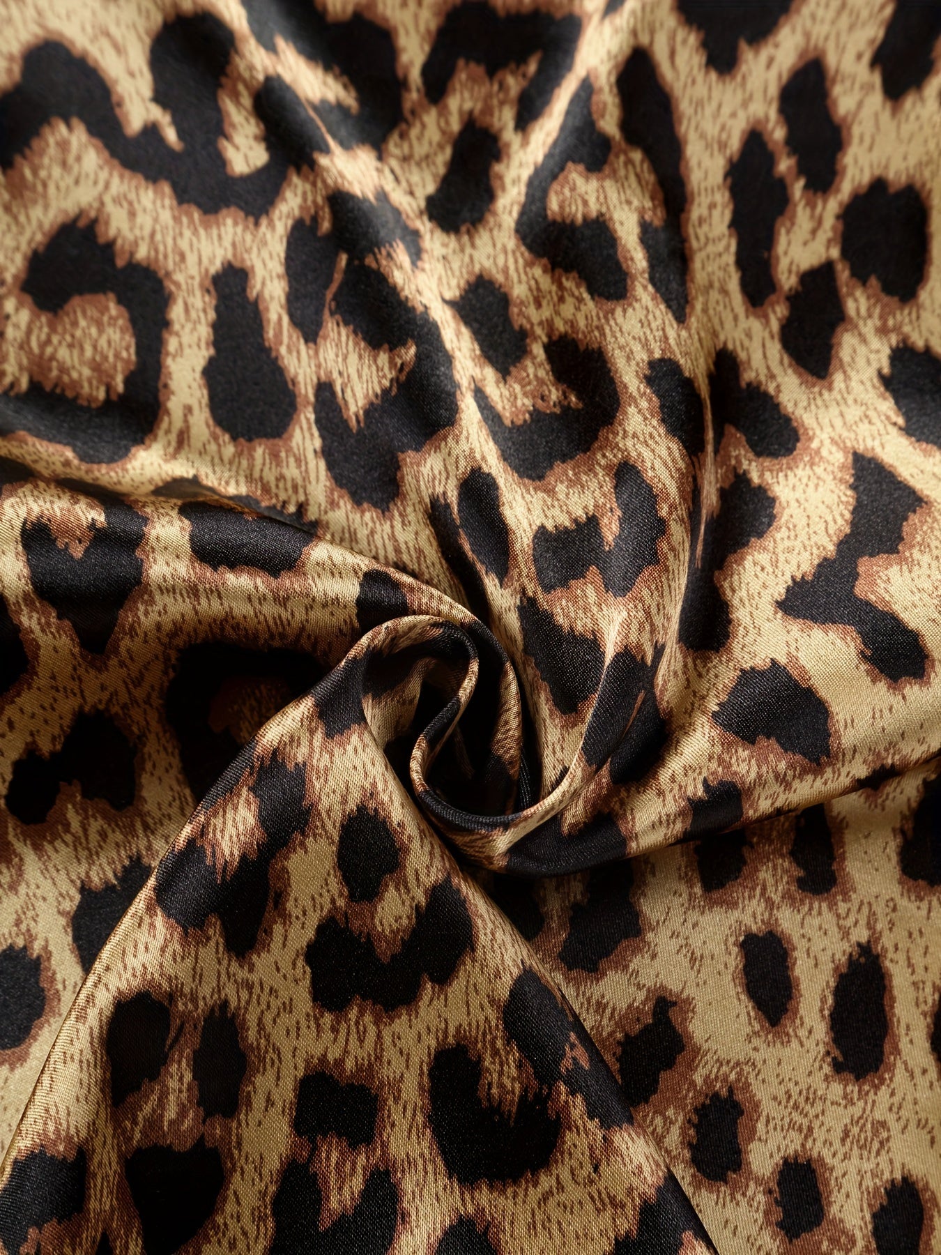 Comfortable leopard print pajamas with front buttons, long sleeves, elastic waistband, and long pants for home wear.