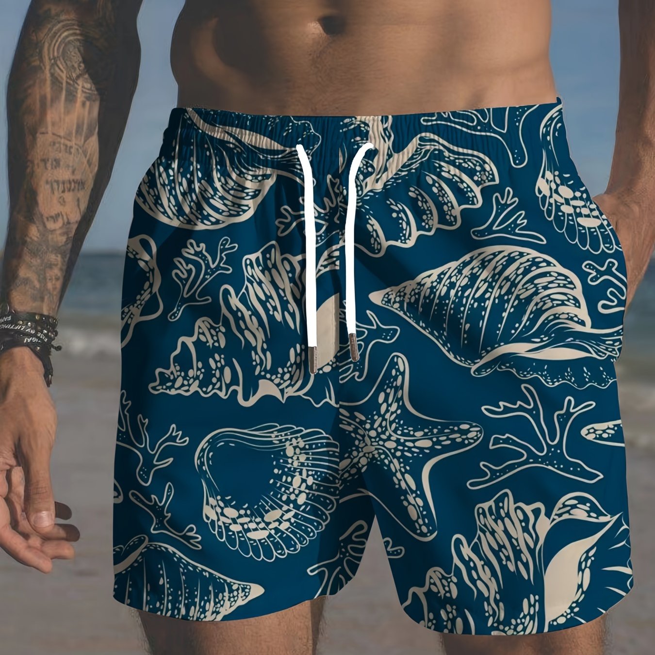 Plus size men's beach shorts with tropical print, elastic drawstring waist and pockets.