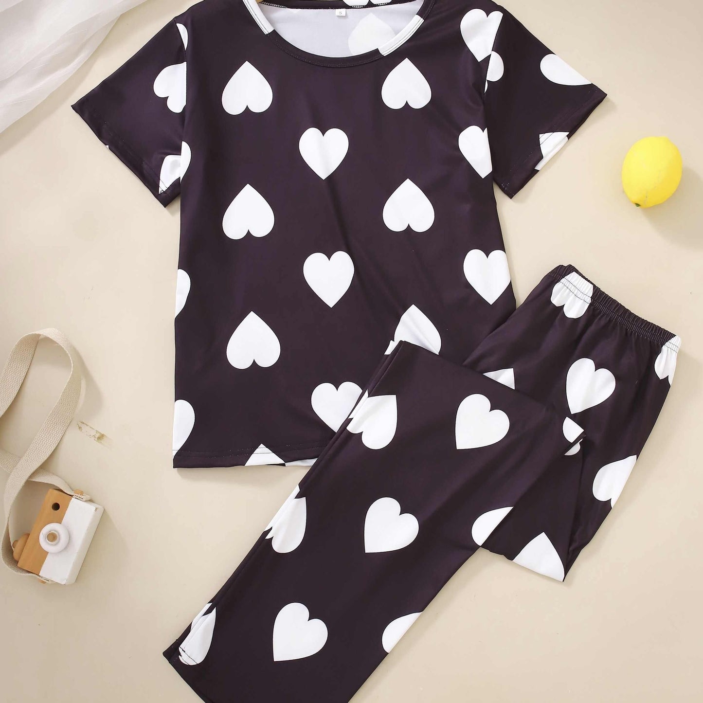 Two-piece pajama set with short-sleeved top and long pants in print.