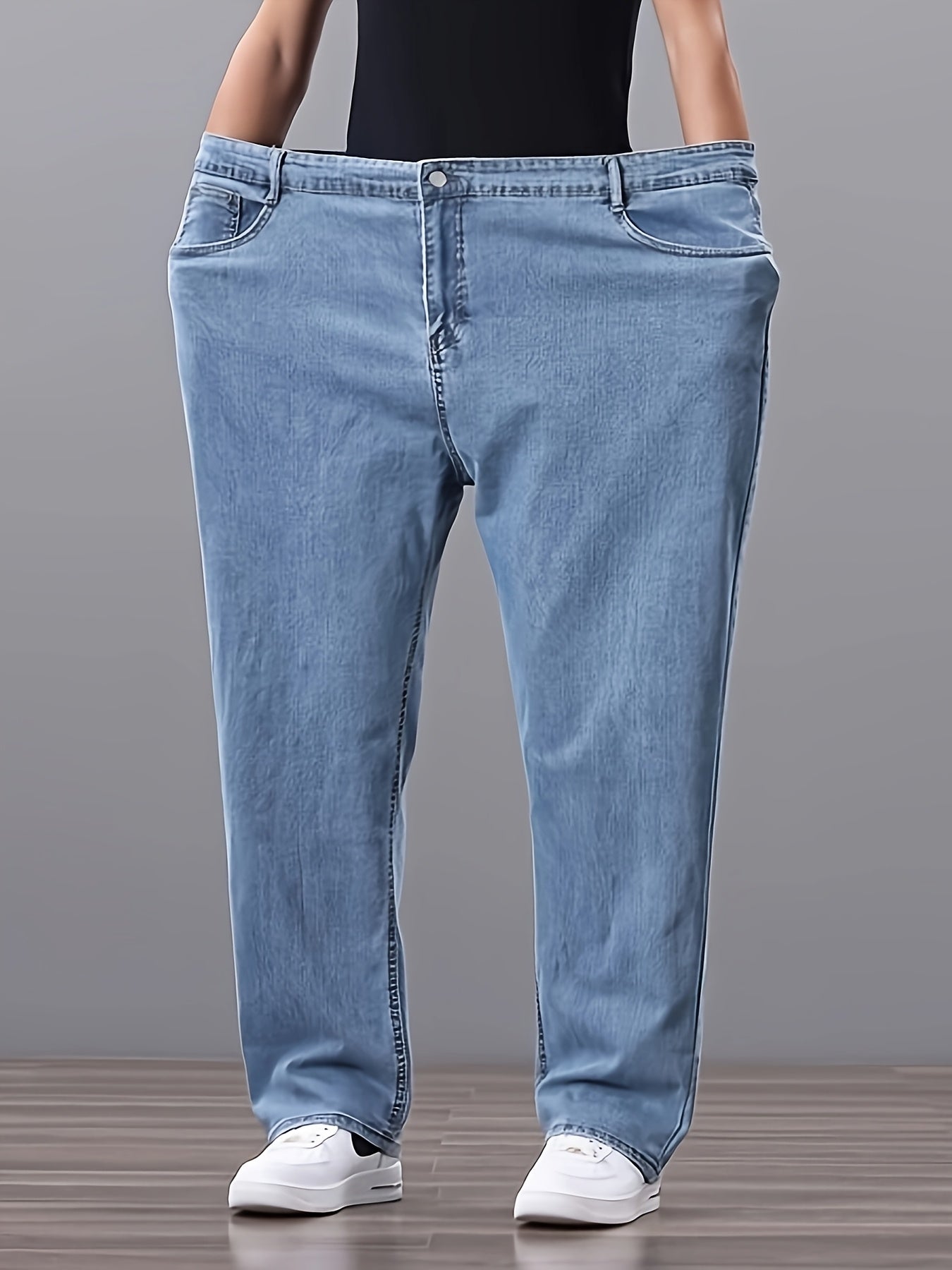 Men's high-waisted denim jeans with stretch fit in a solid color. Features regular fit, straight leg, and made of 45% cotton, 33% polyester, 1.5% spandex, 20.5% rayon. Lightweight at