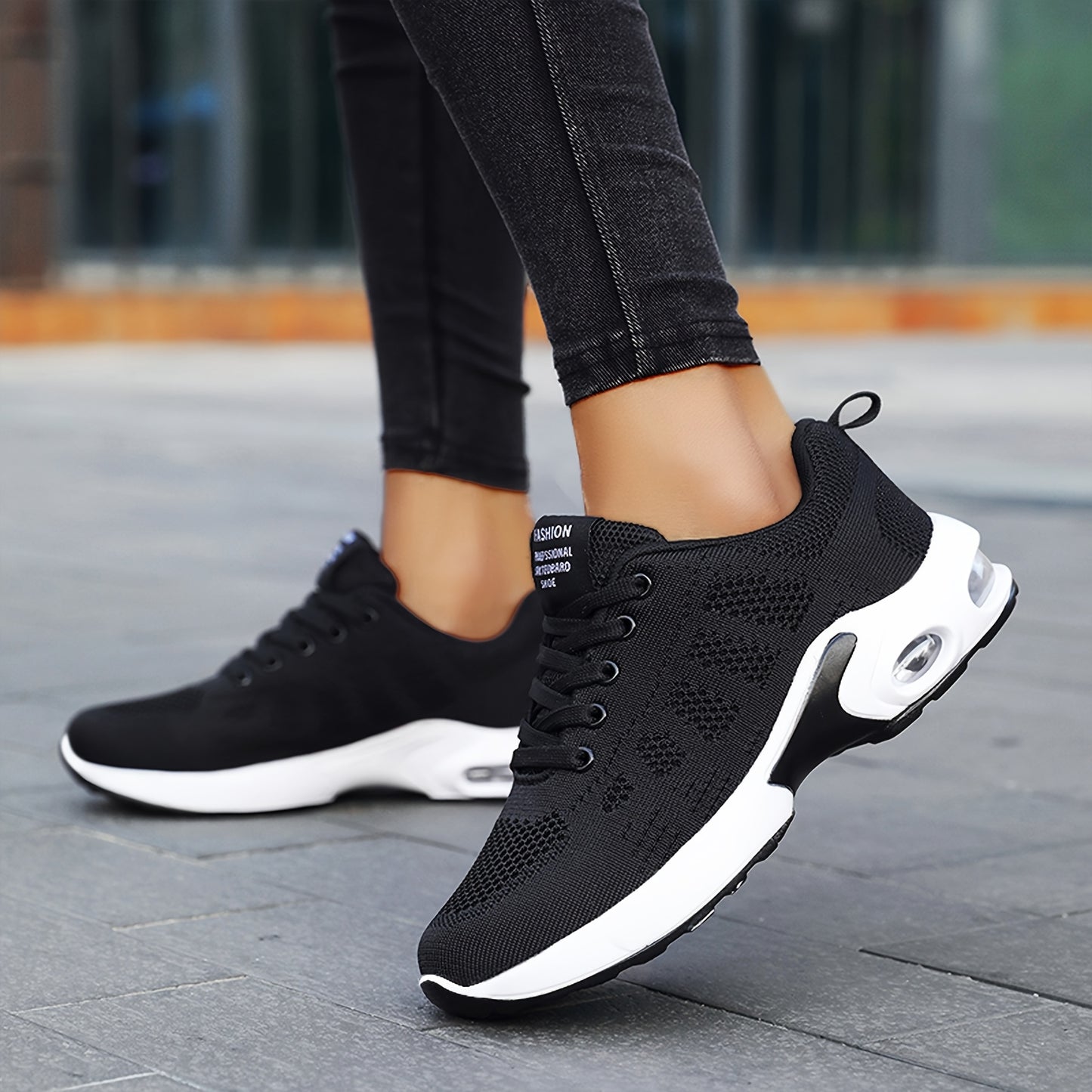 Women's lightweight black knit running shoes with air cushion and mesh upper for all-day comfort and casual wear.