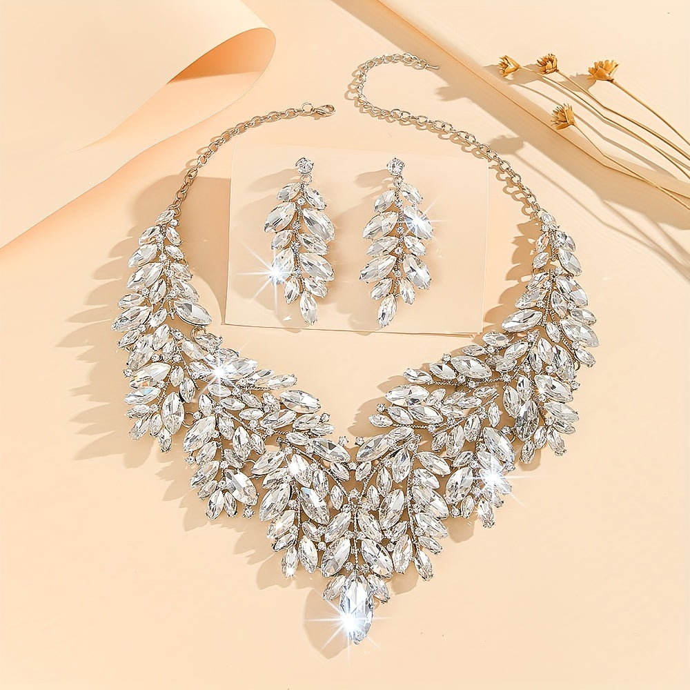 Luxurious wedding jewelry set crafted with fine materials and adorned with shimmering artificial crystals. This exquisite 3-piece set includes a necklace and earrings, perfect for weddings and special events. A timeless gift for any occasion, making it