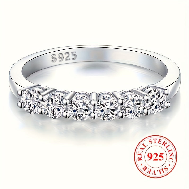 High quality gift for a special person, this 925 Sterling Silver Eternity Ring features a line of sparkling zirconia, perfect for engagement or wedding.