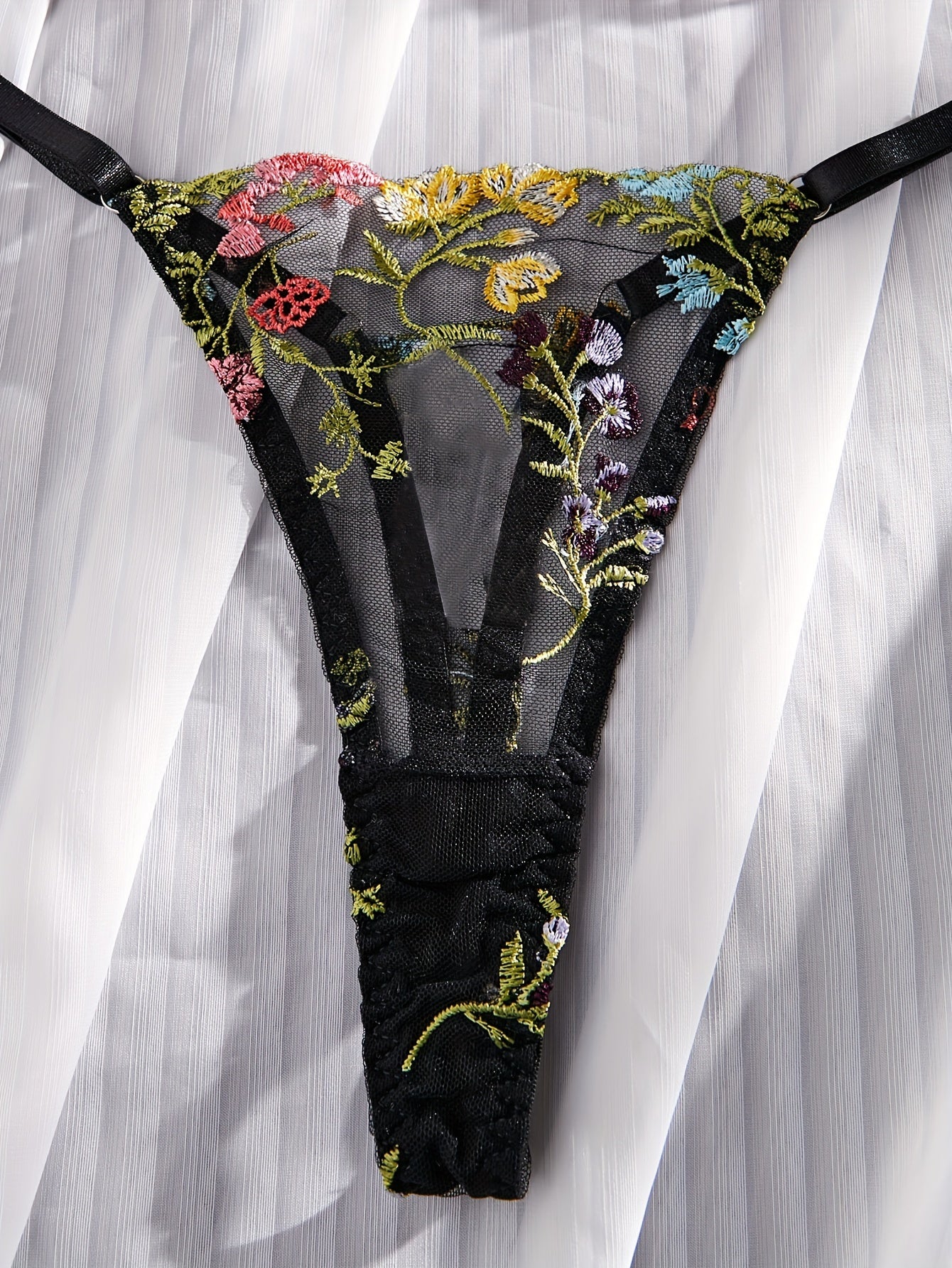 Floral embroidery underwear set with semi-transparent gathered bra and thong panties for a sexy and fresh look.