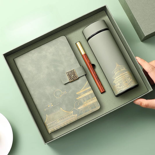 Forbidden City-themed gift set includes insulated mug and notebook, suitable for daily office use and corporate gifting. Smooth finish with dotted lines.