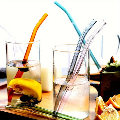 A package containing 6 high borosilicate transparent glass straws and 1 cleaning brush. These heat-resistant, washable, and reusable straws are perfect for enjoying your favorite drinks.