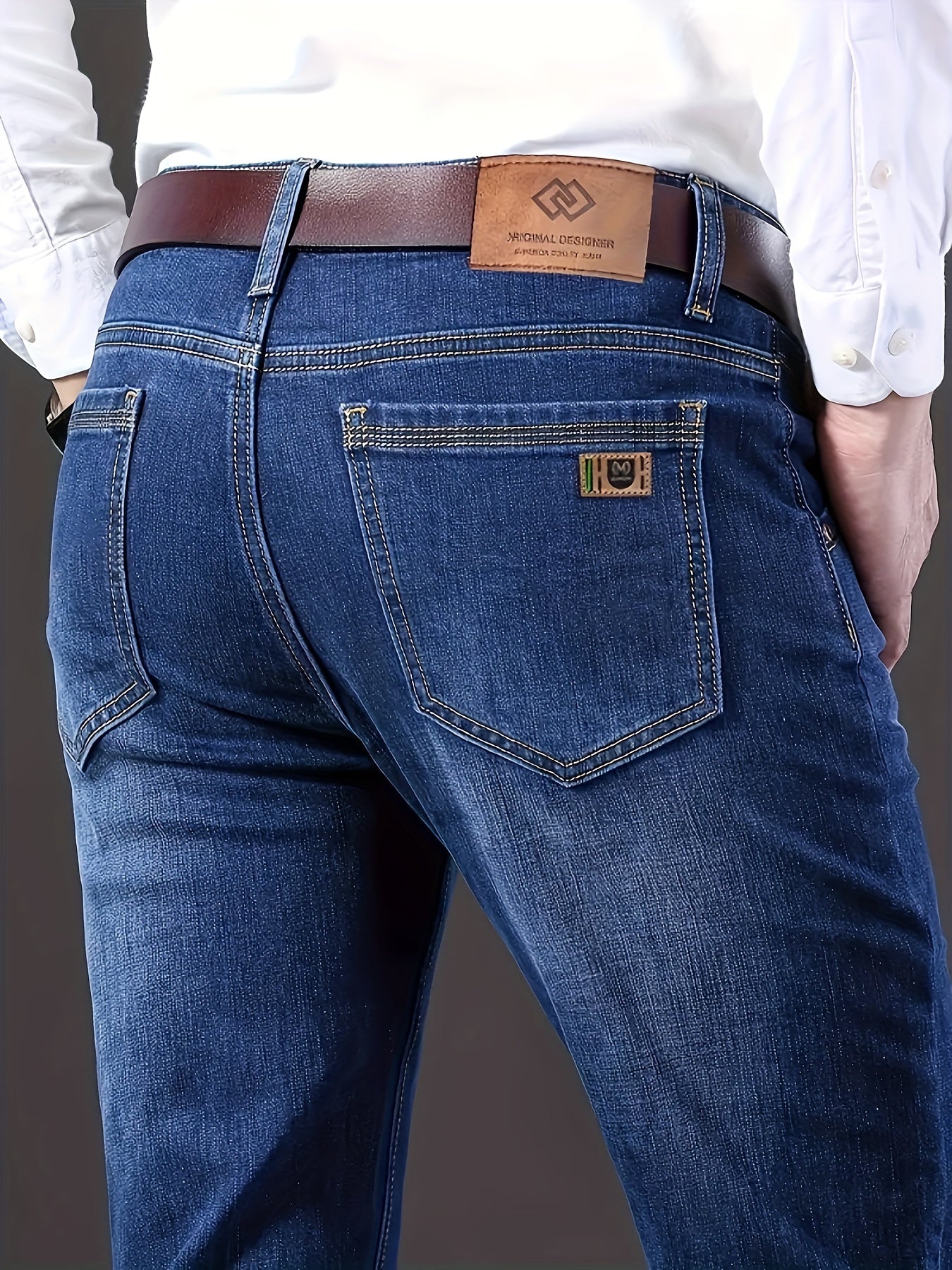 By 2025, the new selection of men's mid-rise cotton stretch straight-fit business jeans features a zipper and button closure.