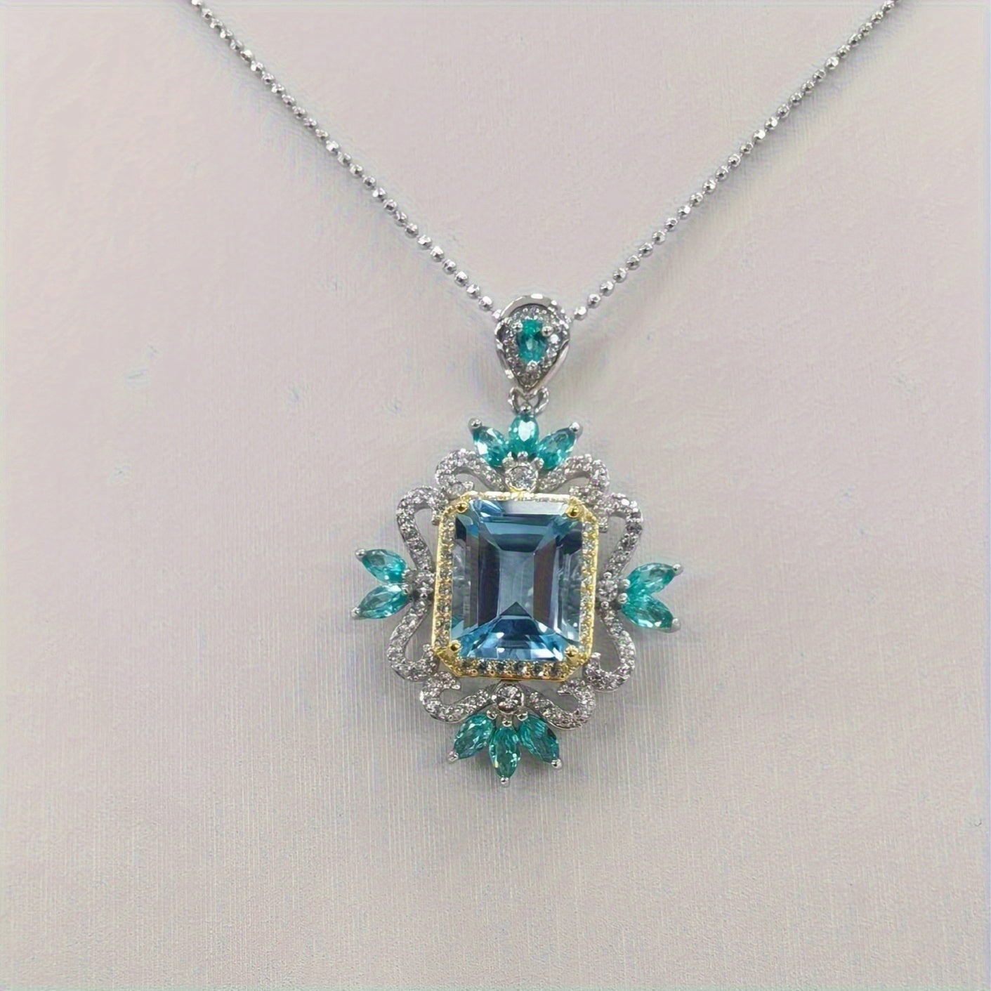 Stylish and lavish 14K gold plated alloy pendant necklace featuring synthetic crystal and imitation topaz, designed in a fashionable European style with high carbon drill rhinestones for women. Perfect for everyday wear and as a gift.