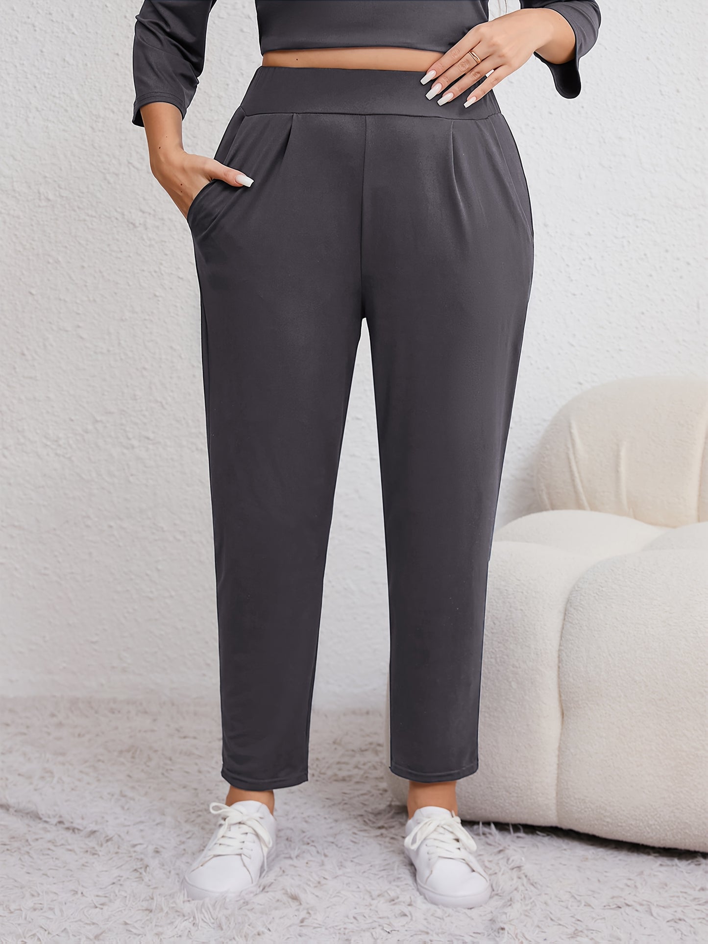 Plus size women's harem pants with high elasticity, ruched waist, pockets, and versatile for all seasons.