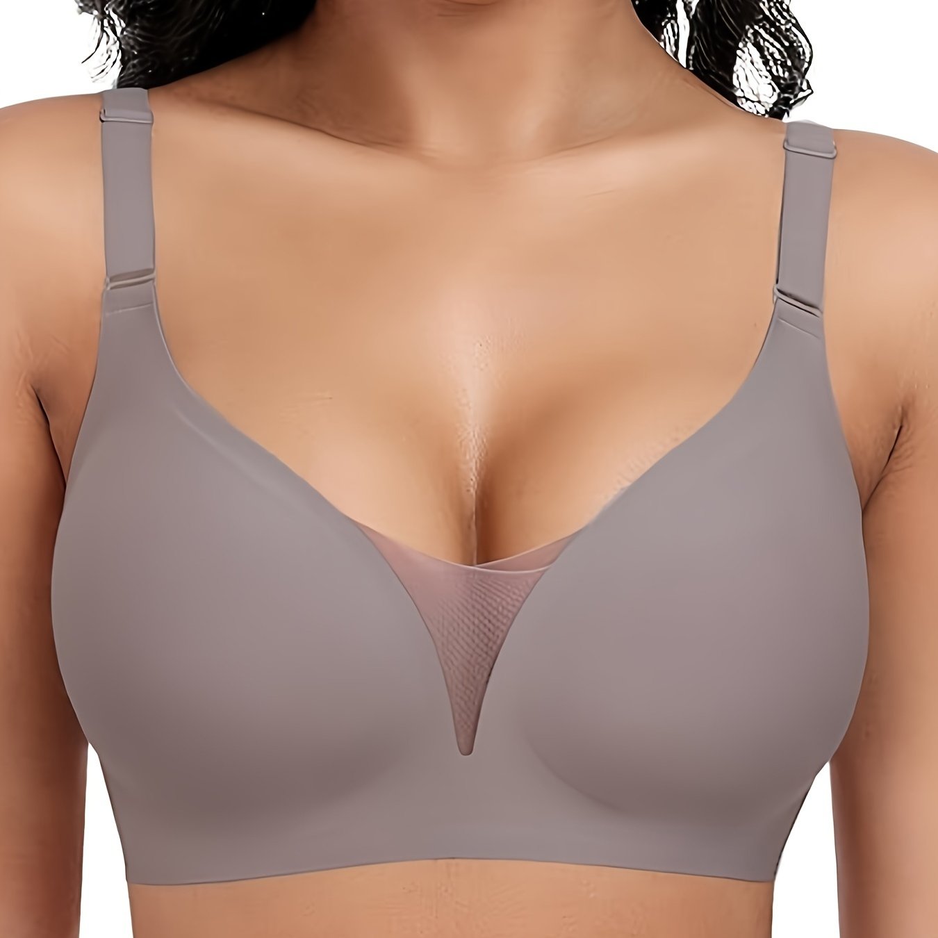 Wireless sports bra for women with seamless design for comfort and support, enhanced by lace and mesh details.